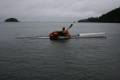 swimmer_halfway_on_the_back_deck.jpg